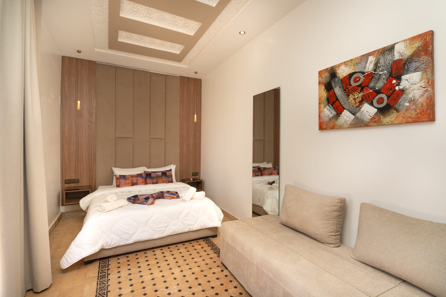 Double room with sofa and framed artwork